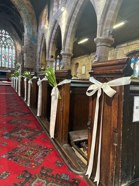 Elegant fresh white tulips and satin ribbon lined the aisle for this beautiful spring church wedding. Designed by Cheryl Louise  Venue: St James' Church, Staffordshire, UK Isle Decorations Wedding Church, Church Wedding Decorations Simple, Church Aisle Wedding Decor, Church Wedding Candles, Chapel Wedding Decorations, Church Aisle Decorations Wedding, Church Ceremony Decorations, Church Wedding Aisle, Church Decorations Wedding