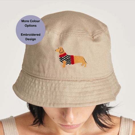 Looking for the perfect sustainable gift idea for the eco-conscious Dachshund lover in your life? 🐾 Say hello to our embroidered Dachshund bucket hat made from organic cotton! Not only is this hat stylish and perfect for festivals and summer days, but it's also eco-friendly, supporting a greener planet. Show your love for both Dachshunds and sustainability with this adorable and practical accessory. .#DachshundGiftIdeas #SustainableFashion #EcoFriendly #OrganicCotton #GreenPlanet #DachshundLo... Dog Bucket Hat, Embroidered Dachshund, Festival Hat, Dog Hat, Navy Grey, Summer Hat, Dog Walker, Beach Hat, Dachshund Dog