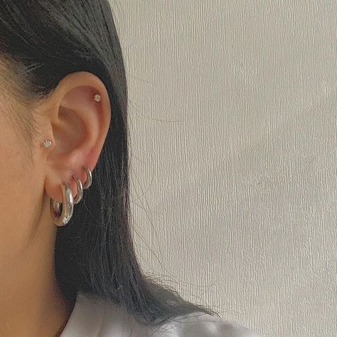 Silver Earrings 3 Holes, Silver Earrings Set Up, Silver Hoop Piercings, Minimal Ear Piercings Silver, Silver Earrings Layered, Mix Gold And Silver Earrings, Silver Hoop Earrings Chunky, Layered Silver Earrings, Curated Ears Silver