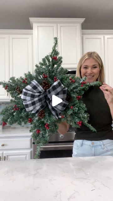 Laura Jeanne on Instagram: "Another Dollar Tree hack using mini Christmas trees 🎄 How pretty and simple is this snowflake wreath?!! 🥰  With the exception of the ribbon, everything was purchased from Dollar Tree.  I’m considering adding lights…🫣😭 I guess it depends on where I decide to hang it.  What do you think? #christmas2023 #christmasiscoming #christmasdiy #christmasdecorations #foryoupagereels #fypシ゚ #dollartreehacks" Dollar Tree Snowflake Wreath, Dollar Tree Christmas Crafts Diy 2023, Dollar Tree Christmas Tree Ideas, Snowflake Wreaths, Diy Snowflake Wreath, Christmas Tree Wreath Diy, Christmas Snowflakes Wreath, Mini Christmas Trees, Dollar Tree Christmas Decor