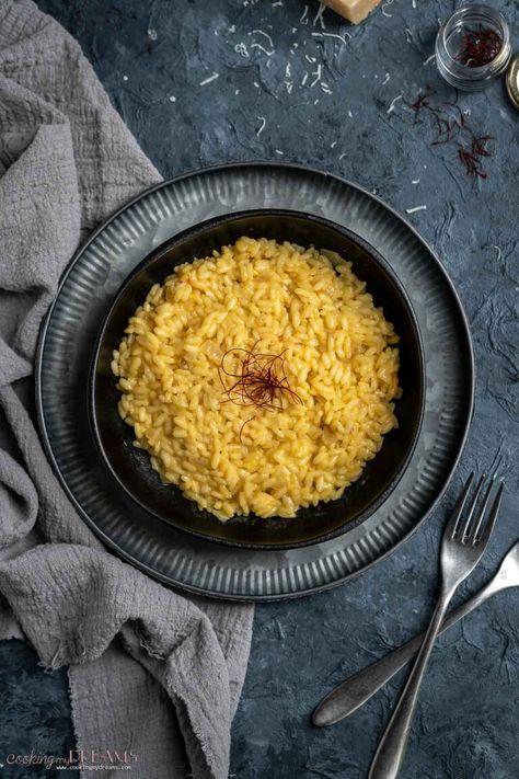 A bright yellow and flavorful risotto. Risotto alla Milanese, or Saffron Risotto, is a classic Italian recipe from Northern Italy, Milan to be exact. It's creamy and delicious, and it's much easier to make than you might think! All you need is good quality ingredients and about 20 minutes to bring this iconic dish to the table! Northern Italy, What Is Risotto, Saffron Risotto, Creamy Risotto, Risotto Alla Milanese, Risotto Rice, Italy Milan, Italian Recipe, Risotto Recipes