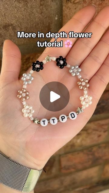 Flower Bead Friendship Bracelet, How To Make A Flower Friendship Bracelet, Beaded Jewelry Flower Tutorial, How To Flower Bead Bracelet, Bead Bracelet Flower Tutorial, Eras Tour 13 Hand Tutorial, Taylor Bracelet Ideas Ttpd, How To Make Flowers On Bracelets, Flowers Bracelets Tutorial