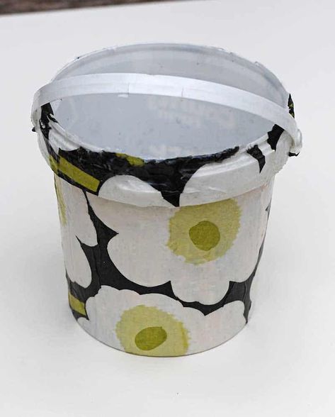 Upcycle old yogurt containers into stylish DIY hanging storage buckets for your craft room. Diy Hanging Storage, Yogurt Container, Mason Jar Bank, Bucket Storage, Painted Shed, Craft Shed, Craft Storage Organization, Plant Pot Diy, Decoupage Glue