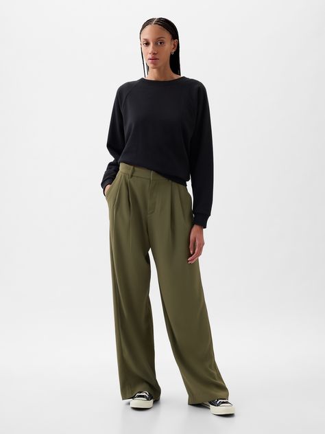 Soft woven trousers.  E-waist with concealed hook and bar closure, zip fly.  Front slant pockets, back welt pockets.  Pleating at front.  * Fit: Classic.  An easy silhouette that fits close  at the waist, and is relaxed through the hips and thigh.  Models wearing Gap Womens Style 2024, Tan And Green Outfits, Olive Green Trousers Outfit, Olive Trousers Outfit, Pleated Trousers Outfit, Olive Outfits, Green Trousers Outfit, Olive Pants Outfit, Dark Khaki Pants