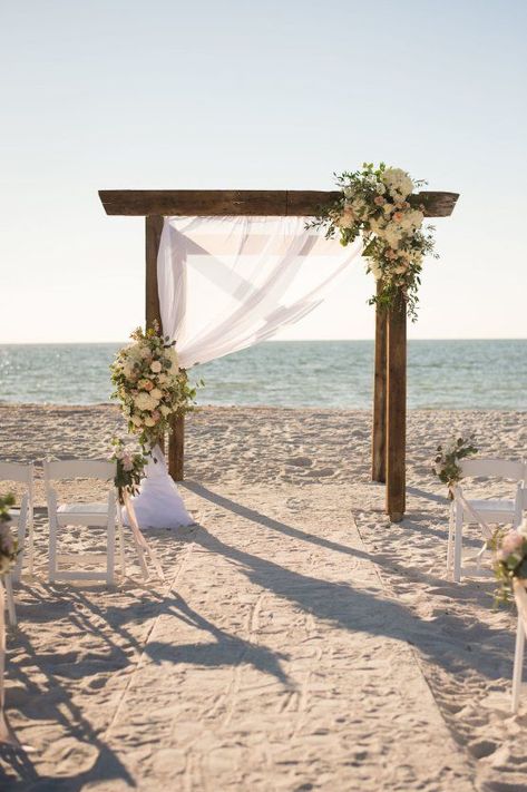 Pretty Pink Beach Wedding With An Elegant, Formal Reception | Stephanie A Smith Photography | Carolina Herrera Wedding Dress | wooden alter with blush roses, peonies, eucalyptus & draped fabric Pink Beach Wedding, Carolina Herrera Wedding Dress, Beach Wedding Pink, Dream Beach Wedding, Beach Wedding Reception, Beach Wedding Inspiration, Wedding Beach Ceremony, Beach Ceremony, Beach Wedding Decorations