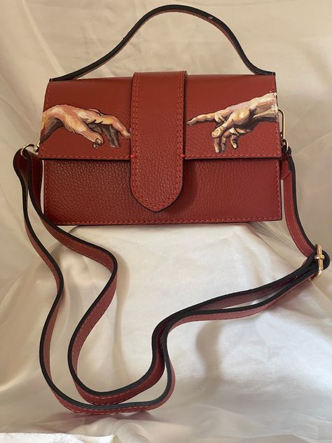 This Sling Bags item is sold by MLynnMDesigns. Ships from United States. Listed on 10 May, 2024 Hand Painted Leather Bag, God Hand, Painted Leather Bag, Classic Outfits For Women, Handpainted Bags, Painted Bags, Gods Hand, Leather Paint, Hand Painted Leather