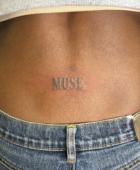 Muse Word Tattoo, Lower Back Tattoo Aesthetic, Tramp Stamps Words, Love Me Tattoo On Lower Back, Muse Tattoo Ideas, Tramp Tattoos Lower Backs, Tattoos For Brown Skin, Brown Tattoos On Brown Skin, Muse Tattoo Words