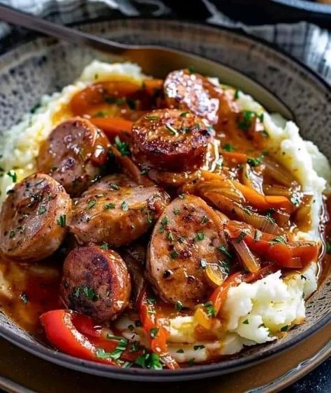 Giada De Laurentiis 🍕🍜 | Rustic Italian Sausage with Peppers and Onions over Garlic Mashed Potatoes | Facebook Sausage With Peppers And Onions, Garlic Mashed Potatoes Easy, Easy Mashed Potatoes, Easy Peasy Recipes, Italian Sausage Recipes, Baked Potato Casserole, Cheesy Mashed Potatoes, Rustic Italian, Garlic Mashed Potatoes