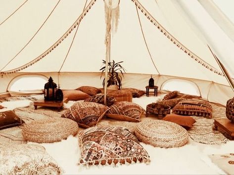 Forgoing the sleeping bags and rickety tents of traditional camping, glamping is a much more luxurious way to enjoy the great outdoors in style. #interior #interiordesign #interiordecor #interiordecoration #decor #decoration #design #bathroom #bathroomdesign #bathroomdecor #kitchen #kitchendecor #kitchendesign #homedecor #homedecoration #exterior #exteriordesign Boho Glamping Tent, Boho Bell Tent, Boho Tent Decor, Glamping Bell Tent, Boho Tent Party, Bell Tent Party, Bell Tent Wedding, Bell Tent Decor, Glamping Tent Decor