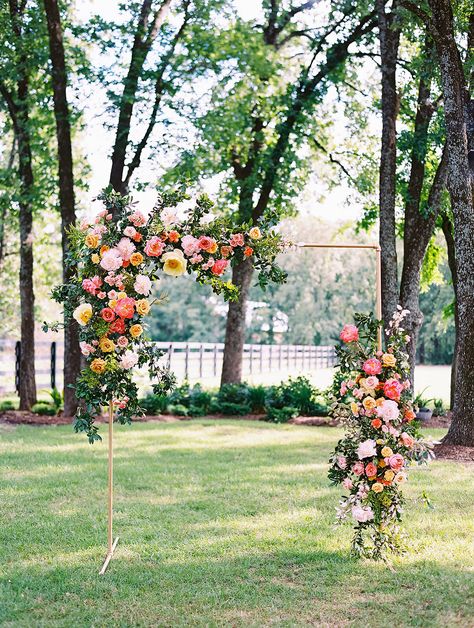 Whimsical Wedding Arbor, Archway Decor Wedding, Colorful Wedding Arbor, Colorful Floral Arch Wedding, Wildflower Ceremony Arch, Wedding Arch Flowers And Fabric, Wildflower Archway, Flower Arch Indoor, Flowers For Aisle