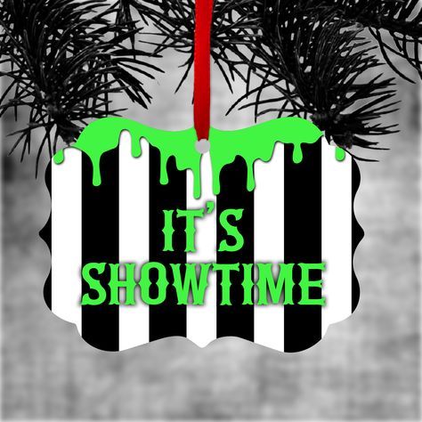 Beetlejuice ornament/ Halloween tree holiday ornament/ gift tag featuring Beetlejuice’s black and white stripes with the quote, “It’s Showtime” in neon green and adorned with dripping green slime. This ornament is printed on 1 side and is not customizable. This is a flat, 2.76" tall X 3.95" wide Benelux shape ornament and is made of high quality aluminum. Imprinted in rich full color on 1 side and includes ribbon for hanging. Beetlejuice Its Showtime, Beetlejuice Ornaments, Beetlejuice Tree, Horror Wreaths, Beetle Juice Halloween Decorations, Beetlejuice Bedroom, Beetlejuice Christmas, Horror Ornaments, Beetlejuice Party