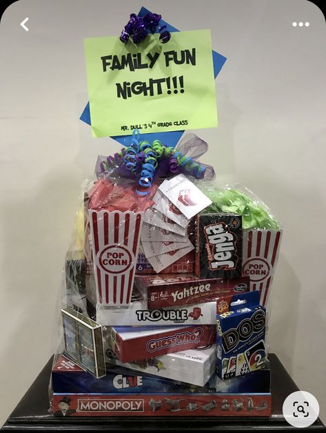 Games Gift Basket Ideas, Cornhole Raffle Basket, What To Put In A Movie Night Gift Basket, Family Fun Auction Basket Ideas, Board Games Basket Ideas, Family Game Night Raffle Basket Ideas, Family Game Basket Ideas, Game Night Gift Basket Ideas Adults, Family Game Night Tournament