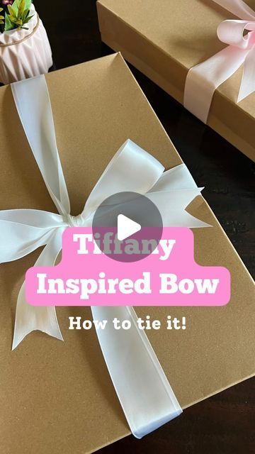 The Shortcut Girl • Tips & Tricks for Home + General Life on Instagram: "This bow is T.I.P Timeless. Iconic. Perfect  #wrapping gifts #giftwrappinghacks #bowsbowsbows #giftwrapping #giftboxideas #wrappinghacks #giftwrappingideas #giftwrapped #presentwrapping #bowtutorial #bowmaking #giftwrap" Tie Bow On Present, How To Put Ribbon On A Gift, How To Tie A Bow Around A Present, Tying A Gift Bow, Box Bow Wrapping, How To Wrap A Robe As A Gift, Tying Gift Bows, Tying Ribbon Around Boxes, Bows On Gifts Wrapping Ideas