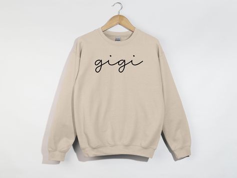 Gigi Sweatshirt, Gigi Hoodie, Gigi Shirt, Gigi Gifts, Gigi Crewneck, Gigi Birthday Gift For Grandma, Best Gigi Ever, Mothers Day Gift. PRODUCTION TIME: 1-3 days (Typically within 2 days) SHIPPING TIME: 2-5 days (Typically 3 days) PRODUCT DESCRIPTION: The Gildan UNISEX Sweatshirt (18000) is crafted from high-quality materials. The Gildan Heavy Blend garment offers an impeccable fit and a plush, comfortable feel.  CARE INSTRUCTIONS: - Machine wash: warm (maximum 40C or 105F) - Use non-chlorine ble Gigi Birthday, Gigi Gifts, Birthday Gift For Grandma, Gigi Gift, Gigi Shirts, Birthday Gifts For Grandma, Gift For Grandma, Care About You, Grandma Gifts