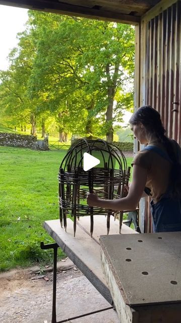 Charlotte on Instagram: "Building a cloche from coppiced hazel 🌳 

The long dark winter has finally ended 🌞 and the sun has woken up the garden with real urgency! Everything is leafing out and growing before our eyes. 

Hazel structures like these are an elegant solution to lush, frothy growth that becomes top heavy and requires a little extra structural support. 

Before long the entire thing will be covered with blooms and foliage, but while we wait, the frame itself is welcome decoration ☺️

#cloche #hazelcoppice #gardenstructure #plantsupport #woodlandmanagement #rosearch #weaving #traditionalskills #handmade #naturalmaterials" Willow Cloche, Winter Garden Decoration, Winter Garden Ideas, Garden Cloches, Eyes Hazel, Front Yard Flowers, Garden Cloche, Rustic Wood Projects, Cloche Decor