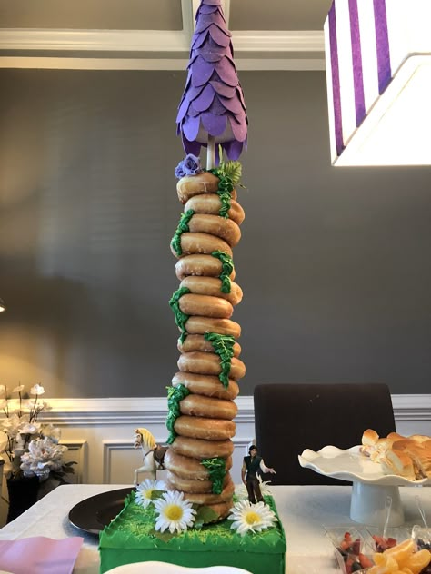 Donut tower, Tangled Tangled Snack Ideas, Tangled Candy Table, Rapunzel Themed Snacks, Rapunzel Donut Tower, Tangled Dessert Table, Tangled Theme Food, Tangled Themed Desserts, Rapunzel Dessert Table, Tangled 16th Birthday Party