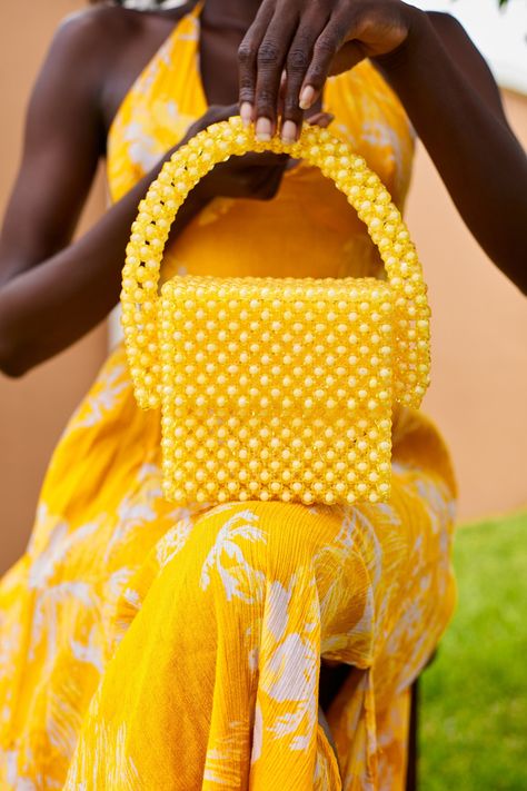 These exquisite Yellow Sugar Beads are carefully handcrafted in Ghana, making them a luxurious and unique addition to any purse collection. Each bead is carefully chosen for its vibrant yellow color and pattern. Measurements including bag handle: Height 9 inches, Length 8 inches, Depth 3 inches Measurements without bag handle: Height 6 inches, Length 6 inches, Depth 3 Inches other colors available Beads Bag, Sugar Beads, Hand Beaded Bag, Purse Collection, Museum Gift Shop, Bead Bag, Museum Gift, Embroidery Bags, Pearl Bag