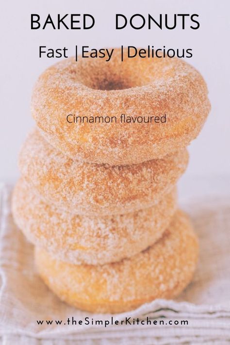 A stack of delicous homemade baked donuts. This recipe is quick and easy. You don't need a doughnut pan, a muffin pan will do. Rolled in cinnamon sugar for great flavour. Simple Donuts, Donut Cake Pan Recipe, Homemade Baked Donuts Recipe Easy, Bake Donuts Recipe Easy, Best Baked Doughnut Recipes, Baking Doughnuts Recipe, Doughnut Recipe Easy Baked, Simple Baked Donut Recipe, Simple Doughnut Recipe