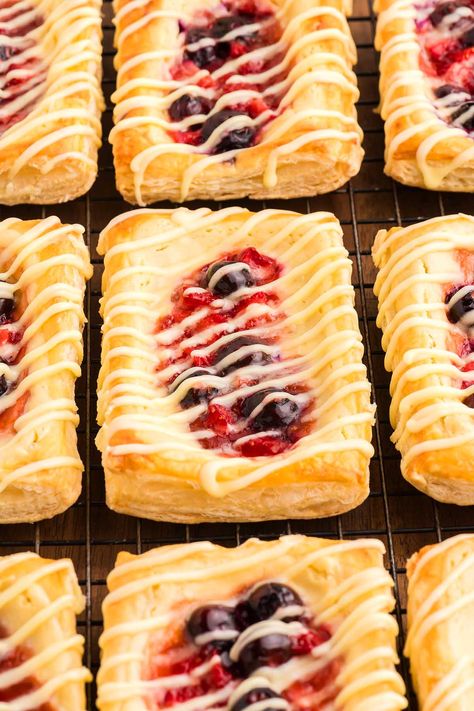 If you like to start the day with something delicious, stop scrolling, bookmark this recipe and whip up a batch of flavorful Danishes. They're soft, sticky and just bursting with incredible creamy, fruity flavors in every bite. You can use whichever fresh berries happen to be your favorite to customize them. These tasty little bites, served fresh from the oven, are sure to impress everyone at the breakfast table. Or you could serve them as sweet treats with a coffee or even have them for ... Fruit Danish Recipe, Berry Danish, Cream Cheese Danish Recipe, Cheese Danish Recipe, Danish Recipe, Cream Cheese Danish, Puff Pastry Dough, Stop Scrolling, Danish Food