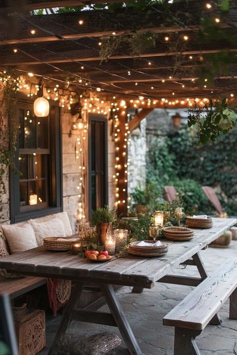 "Create a warm and welcoming atmosphere with a Rustic Outdoor Dining Area! 🍽️🌾 Perfect for enjoying meals under the stars. 🌟✨ #OutdoorLiving #RusticDining #GardenDesign" Screened Porch Dining Area, Front Porch Dining Ideas, Rustic Back Porch, Back Porch Dining, Outdoor Dining Area Ideas, Rustic Outdoor Patio, Rustic Outdoor Dining, Landscaping Front Porch, Front Porch Lights