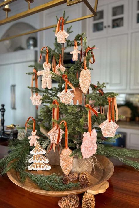 Add a personal touch to your holiday decor with these DIY air-dry clay gingerbread ornaments! Follow this simple tutorial for festive fun. Air Dry Clay Gingerbread Man, Diy Air Dry Clay Christmas Decorations, Gingerbread House Ornaments Diy, Diy Clay Christmas Decorations, Air Dry Clay Ornaments Christmas, Clay Gingerbread Ornaments, Air Dry Clay Ornaments Diy, Gingerbread Ornaments Diy, Diy Gingerbread Ornaments