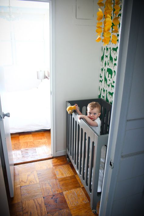 One of the things I still get the most questions about is the mini-crib (and mini-nursery) we used with Hudson in New York. We lived in a 500-square-foot studio, so we transformed our walk-through closet (translation: Aron had to move his clothes into our entry closet) into a little nursery space for with some wallpaper, … Convert Walk In Closet To Nursery, Simple Nursery Ideas Neutral, Nursery In A Closet, Newborn Things, Mini Nursery, Closet Nursery, Tiny Nursery, Nursery Layout, Nursery Accents