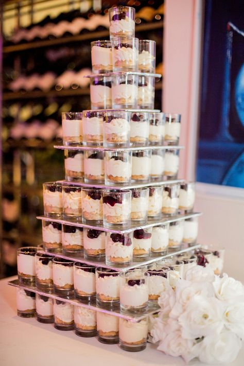 blueberry cheesecake shot glass dessert tower Dessert Tower, Shooter Glass Desserts, Cheesecake Shooters No Bake Recipe, Blueberry Cheesecake Shooters, Oreo Cheesecake Shooters Dessert Recipes, Cheesecake Tower Wedding, Blueberry Wedding, Shot Glass Desserts, Wedding Cheesecake