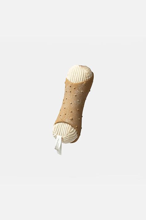 Delizioso! Cannoli has got to be one of our most beloved kitchen favorites and we finally have it in doggie toy form! This 2-in-1 toy set is made from high quality rubber that is both fun and durable which means it can be chewed, squeaked, thrown, rolled in the dirt – you name it! The wrinkle paper inside adds an extra splash of fun. Just don’t be fooled into thinking that your parents won’t steal it! **Contents** * Main Fabric: Polyester * Imported **Dimensions** * 3'' X 3.5'' X 9'' | Silver Paw Cannoli Dog Toy at Free People in White Kitchen Favorites, Pet Corner, Crinkle Paper, Toy Puppies, Got To Be, Cannoli, Toy Sets, Dog Supplies, New Puppy