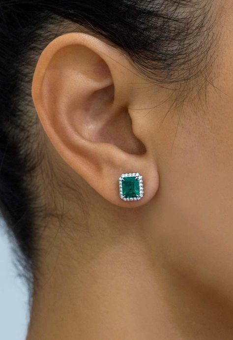 For Sale on 1stDibs - This beautiful pair of earrings showcases emerald cut green emeralds weighing a total of 2.41 carats. Each emerald is surrounded by a row of 44 brilliant Halo Earrings Studs, Colombian Emeralds, Emerald Diamond, Emerald Cut, Emerald Green, Halo Diamond, Halo, Emerald, Stud Earrings