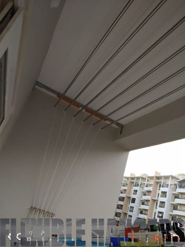 Flexible Cloth Hangers Pulley are of premier quality stainless stell rods, rust  free and for long lasting use. This pull down cloth Hangers Pulley system gives optimum Space between individual pipes and allows smoth airflow between cloths In All Bangalore Services Call Or Whatsapp [+91 9901015732] Ceiling Clothes Hanger, Pulley System, Door Steps, Bangalore, Clothes Hanger, Hangers, Blinds, Rust, Decor Ideas