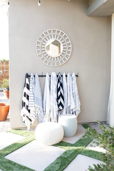 Towels By The Pool, Decorating Your Pool Area, Pool Deck Inspiration, Pool Area Organization, Poolside Wall Decor, Elegant Pool Decor, Pool Entryway Ideas, Beach Towel Rack Outdoor, Pool Towel Basket