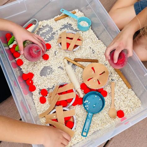 Looking for an easy Apple sensory bin for fall? This apple pie sensory bin for preschoolers is perfect! Little ones will enjoy scooping, pouring, and creating their own little pies! What fun! Check out this apple pie sensory table idea today. Apple Pie Sensory Bin, Apple Sensory Bin Preschool, Sensory Bins For Preschool, Apple Sensory Bin, Pie Sensory Bin, Sensory Bin For Preschoolers, Apple Sensory, Sensory Table Ideas, Harvest Activities