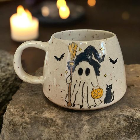 ✨ 🕯️ Witchy Ghost 🕯️ ✨ #pottery #handmade #handmadepottery #londonpotters #ceramics #ceramicart #autumn #autumnvibes #stoneware #wheelthrown #coffee #coffeetime #coffeelover #coffeeshop #mug #coffeemug #tableware #halloween #handmadeceramics #functionalpottery #londonartist #handmadepottery #mugs #functionalceramics #handthrown #handcrafted #handmademug #pottersofinstagram #wheelthrowing Painted Pottery Halloween, Halloween Mug Painting Ideas, Paint A Pot Ideas Mug, Halloween Mug Ideas, Halloween Ceramics Pottery, Halloween Pottery Painting Ideas, Pottery Painting Autumn, Pottery Painting Halloween, Fall Mug Painting Ideas