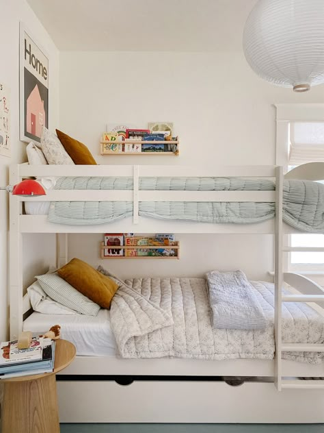 Bunk Beds With Sconces, Bunk Bed Wall Shelf, Bunk Bed In Front Of Window Ideas, Nursery And Kids Room Shared, Gender Neutral Bunk Bed Rooms, Kid Bedroom Storage Ideas, Bunk Bed Wall Decor, Bench In Bedroom Against Wall, Schoolhouse Bedding