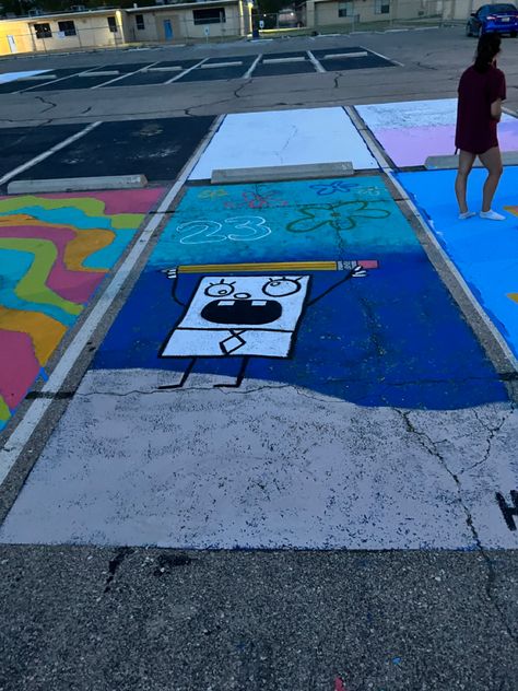 Four Years Later Parking Spot, Cartoon Parking Spots, Senior Parking Spaces Spongebob, Student Parking Lot Painting, Music Themed Senior Parking Spot, Guy Parking Spot Painting, Parking Space Painting Ideas Funny, Boys Painted Parking Spots, Drake Parking Spot Painting