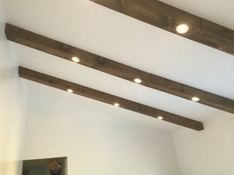 Faux wood beams with recessed lights Exposed Beam Lighting Ideas, Lights In Wood Beams, Beam With Recessed Lights, Wood Beams With Lights, Ceiling Beams With Lights, Beams With Recessed Lighting, Low Profile Beams On Ceiling, Beams With Lights, Faux Beams With Lights