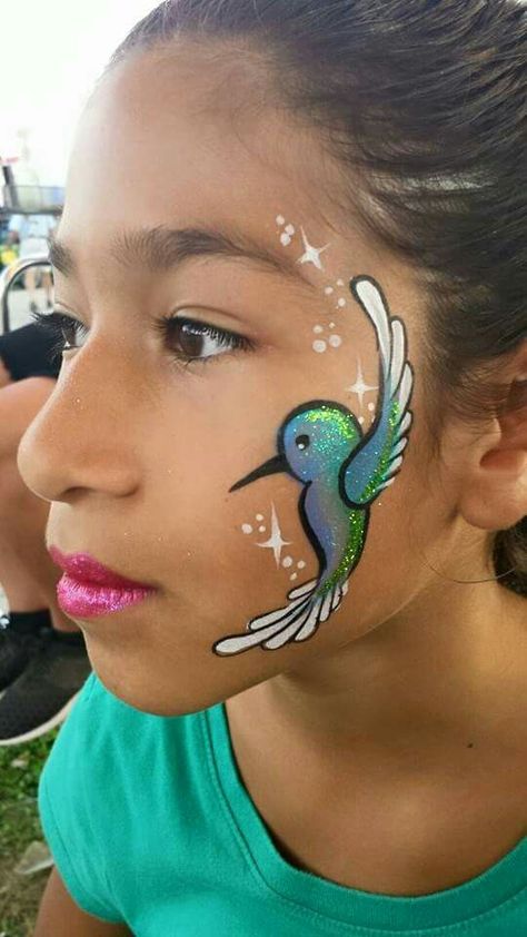 Hummingbird Face Painting. Rainbow Face Paint, Animal Face Paintings, Bodysuit Tattoos, Festival Face Paint, Face Painting Tips, Cheek Art, Girl Face Painting, Face Painting Tutorials, Festival Face