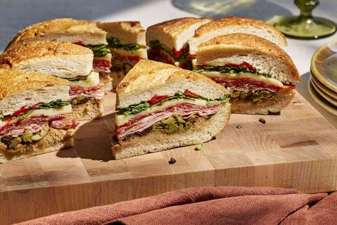 Muffuletta Recipe (With Video and Step Images) Muffuletta Recipe, Hot Weather Meals, Muffaletta Sandwich, Muffuletta Sandwich, Entertaining Dinner, Olive Salad, Breakfast Brunch Recipes, Wrap Sandwiches, A Picnic