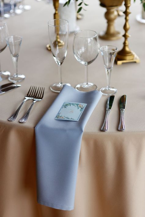 Dusty blue table napkins with cream table cloths and a flower print guest name cards Dusty Blue Napkins, Blue Table Napkins, Arizona Apartment, Dusty Blue Table, Buffet Table Settings, Blue Cloth Napkins, Tablescapes Ideas, Udaipur Wedding, Blue Table Settings