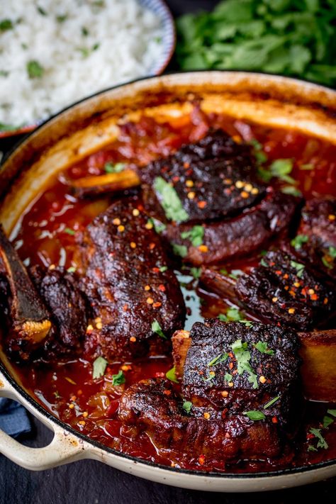 These Caramelized Slow Roast Asian Beef Short Ribs will make your house smell amazing! So tender and tasty - a great weekend dinner! Rib Of Beef Recipes, Amazing Easy Dinners, Beef Shoulder Ribs Boneless Recipes, Braised Beef Ribs In The Oven, Short Ribs Side Dishes, Asian Dutch Oven Recipes, Japanese Short Ribs, Slow Cooked Beef Short Ribs, Short Ribs Recipe Asian