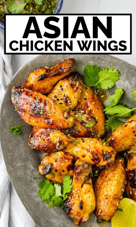 These Asian chicken wings are the best we've ever tried. They're spicy, sweet, tangy and delicious. The Asian chicken wing recipe uses honey, lime juice sriracha, soy sauce, garlic and a bit of fish sauce to flavor the marinade and dipping sauce. You'll love these Asian-style wings for munching as an appetizer or even dinner. Asian Wing Sauce, Wingette Recipes, Soy Sauce Fish, Asian Chicken Wings, Honey Sriracha Sauce, Food Noodles, Crispy Oven Baked Chicken, Wing Sauce Recipes, Wing Recipe