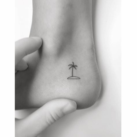 Minimalistic island and palm tree tattoo located on the Tree Tattoos, Palm Tree Tattoo Ideas, Palm Tree Tattoos, Back Of Ankle Tattoo, Tree Tattoo Ideas, Island Tattoo, Palm Tree Tattoo, Palm Island, Minimalist Line Art