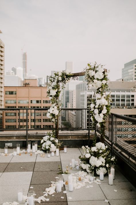 Want to know one way to seal the deal!? Ask Josh, who gave Morgan the proposal of her dreams! After taking Morgan to get a drink just down the street, Josh then led Morgan to the rooftop of the first apartment building that they lived in together, overlooking Lake Michigan and amidst the Chicago skyline. #firstapartment #weddingproposal  #inlove #wedding #engaged #floralarch #candlelitproposal Candlelit Proposal, Rooftop Wedding Decor, Rooftop Wedding Reception, Rooftop Proposal, Chicago Proposal, Cute Proposal Ideas, Rooftop Wedding Ceremony, Proposal Pictures, Romantic Proposal