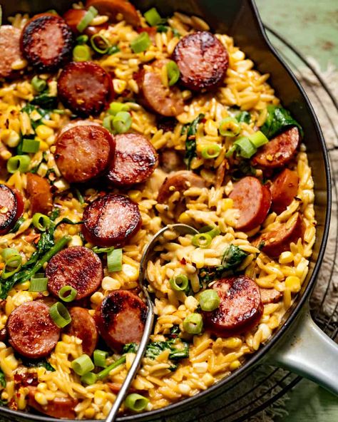 Creamy Cajun Orzo with Sausage (One Pan!) - Britney Breaks Bread Essen, Orzo Sausage Spinach Recipes, Sausage Andouille Recipes, Andouille Sausage Orzo, Dinner Recipes With Sausage Links, Jalepeno Sausage Meals, Orzo Jambalaya, Sausage And Orzo Recipe, Andullio Sausage Recipes