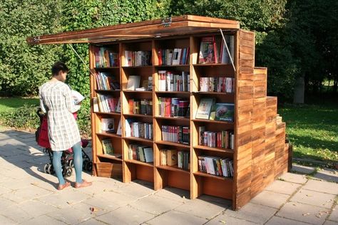 Enticed by the bookstand’s offerings, one reader picks and chooses, casually using the awning as a sunshade. Photo courtesy of Ruetemple Architectural Studio.  Innovative Outdoor Libraries in Russia by Jacqueline Leahy Outdoor Library, Pvc Furniture Plans, Street Library, Outdoor Shelves, Mobile Library, Lending Library, Decorating Bookshelves, Architectural Studio, Space Books