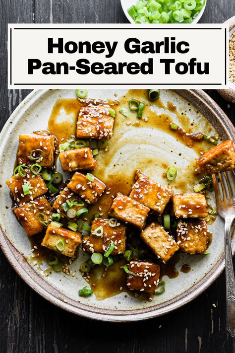 This Honey Garlic Tofu is an easy Asian-inspired recipe with a sticky sauce that glazes over crispy tofu. It’s a delicious vegetarian dish loaded with flavor thanks to honey, garlic, soy sauce, rice vinegar, and toasted sesame oil. Eat alone or serve with a grain and vegetable for a full meal. Honey Garlic Tempeh, Honey Glazed Tofu, Honey Garlic Soy Sauce, Is Tofu Healthy, Honey Garlic Tofu, Garlic Tofu, Soy Sauce Rice, Cravings Recipes, Tofu Recipes Easy