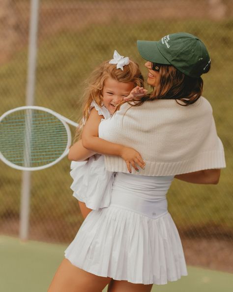 Living my best tennis wife life 🤍🎾 📸 @micarodriguezphoto There’s a strong chance i’ll never be done posting content from this shoot, @micarodriguezphoto creates pure magic ✨ . . . #tenniswife #tenniswifelife #tennisgirl #tennisplayer #tennisaesthetic #countryclublife #pickleball #tennisfamily #tennisfashion #tennisskirt #tenniswhites #pinterestaesthetic #lossundays #tennisdress #familygoals #mommyandme #wilsontennis Kids Tennis Outfit, Tennis Mom, Kids Tennis Clothes, Players Wives, Tennis Court Photoshoot, Tennis Pictures, Tennis Whites, Kids Tennis, Tennis Aesthetic