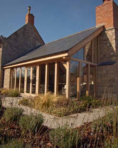 Wooden House Extension, Stone House Extension, This Oak House, Cottage Orangery, Wooden Extension Ideas, Grand Designs Houses Uk, Modern Extension On Old House, Timber Frame Kitchen Extension, Oak And Glass Extension