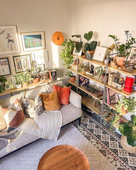 15 Plant Shelf Ideas We Love to Show Off Your Greenery Indoor Garden Shelves, Plant Shelf Behind Couch, Studio Apartment With Plants, Living Room Plant Wall, Bookshelves Plants, Shelf Behind Couch, Plant Shelf Ideas, Plant Decor Living Room, Indoor Plant Display