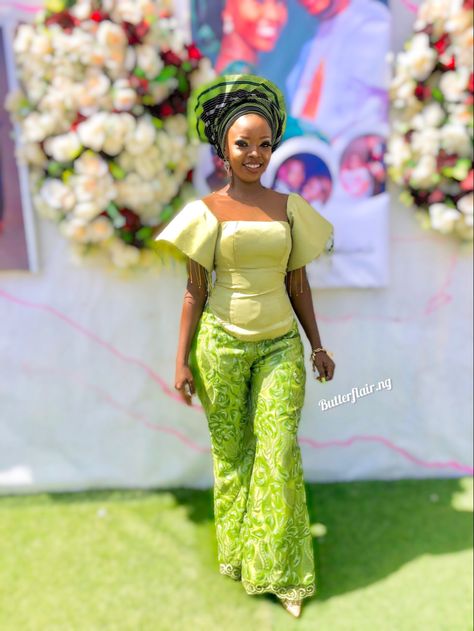 #lace Bell trouser paired with a #corset blouse with a structured flare sleeve with dangling beads. #asoebistyle #asoebispecial #owambe #trousers #asoebi #fashiondesigner #fashionideas #fashionblogger #fashionista #butterflairwoman Asoebi Lace Styles For Wedding, Green Asoebi, Asoebi Styles Lace, Lace Blouse Styles, Asoebi Lace Styles, Tailored Outfits, Asoebi Lace, Owambe Styles, Lace Styles For Wedding